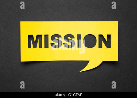 Bubble speech with cut out phrase 'mission' in the paper.