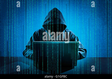 Hacker using laptop. Hacking the Internet. Stock Photo