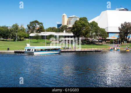 The Festival Theatre complex overlooking the River Torrens in Adelaide Australia. The tourist boat 'Popeye' is sailing past. Stock Photo