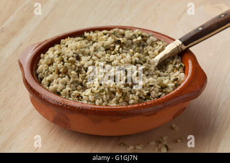 Raw peeled hemp seeds in a bowl Stock Photo