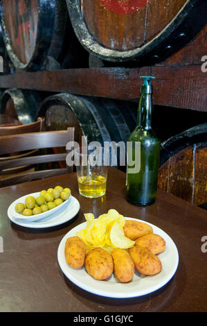 Croquettes serving and olives with cider, Casa Mingo. Madrid, Spain. Stock Photo