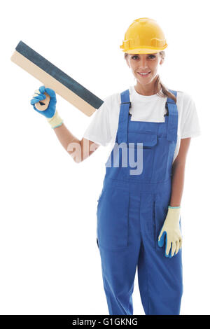 Young beautiful handywoman with masonry trowel isolated on white Stock Photo