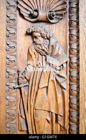 Prague, Czech Republic. St Vitus Cathedral - wooden door with carving of St Paul with a sword and book Stock Photo