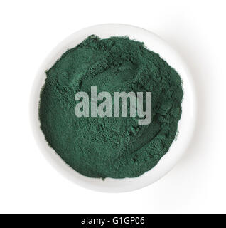 Bowl of spirulina powder isolated on white background, top view Stock Photo