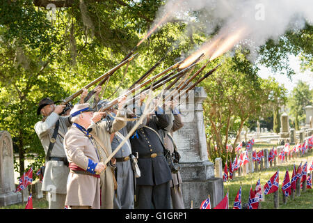Charleston, USA. 14th May, 2016. Confederate re-enactors fire a gun salute to honor the Civil War dead during a memorial service to mark Confederate Memorial Day  at Magnolia Cemetery May 14, 2016 in Charleston, South Carolina. The events marking southern Confederate heritage come nearly a year after the removal of the confederate flag from the capitol following the murder of nine people at the historic black Mother Emanuel AME Church. Credit:  Planetpix/Alamy Live News Stock Photo