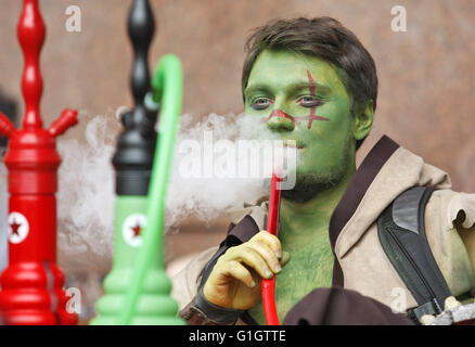 Kiev, Ukraine. 14th May, 2016. A cosplayer smoking at the festival ''Kyiv Comic Con'' in Kiev, Ukraine, 14 May, 2016. The festival of fans comics, cosplay, film and TV series runs from 14 to 15 May. © Serg Glovny/ZUMA Wire/Alamy Live News Stock Photo