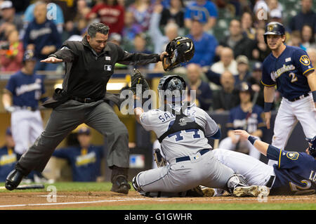 Los Angeles Dodgers' Jonny Deluca, center, is congratulated by Miguel  Rojas, right, after scoring on a balk as Houston Astros catcher Yainer Diaz  kneels at the plate during the eighth inning of