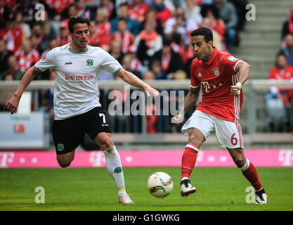 Munich, Germany. 14th May, 2016. Bayern Munich's Thiago Alcantara (R) competes during a German First Division Bundesliga football match between Bayern Munich and Hannover 96 in Munich, Germany, May 14, 2016. Bayern Munich won 3-1. © Philippe Ruiz/Xinhua/Alamy Live News Stock Photo