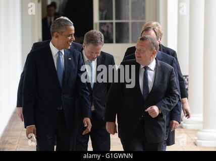 May 13, 2016 - Washington, District of Columbia, United States of America - United States President Barack Obama (L) talks with Denmark Prime Minister Lars Lokke Rasmussen as they and other Nordic leaders walk along the White House Colonnade to the Oval Office during the State Visit in Washington, DC on May 13, 2016. Other Nordic leaders are second row Finland President Sauli Niinisto and Sweden Prime Minister Stefan Lofven (R), third row Iceland Prime Minister Sigurdur Ingi Johannsson and Norway Prime Minister Erna Solberg (R). Credit: Pat Benic/Pool via CNP (Credit Image: © Pat Beni Stock Photo