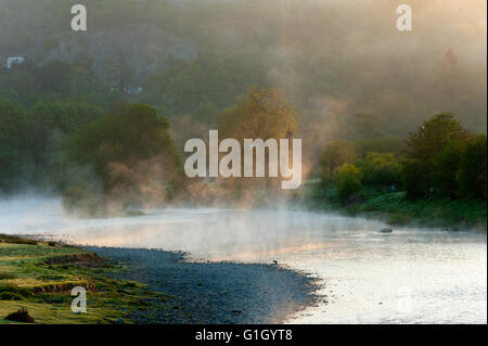 Builth Wells, Powys, Wales, UK. 15th May 2016. After an unseasonably cold night with temperatures dropping to around freezing, mist is seen rising over the River Wye at Builth Wells, Powys, Wales, UK. Credit:  Graham M. Lawrence/Alamy Live News. Stock Photo