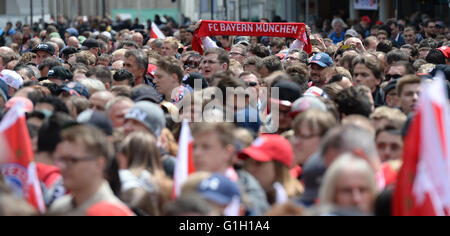 Fans of FC Bayern Munich wait for the team to celebrate the 26th German Championships on Marienplatz square in Munich, Germany, 15 May 2016. Photo: ANDREAS GEBERT/dpa Stock Photo