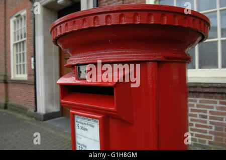 Red post box in Kent - UK Stock Photo