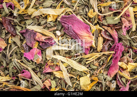 Macro of healthy stomach herbal tea -  a blend of  peppermint, spearmint, ginger, hisbiscus, rosehip, red rose,, almond Stock Photo