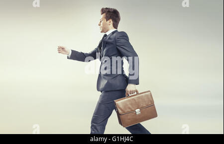 Young businessman running into his big career Stock Photo