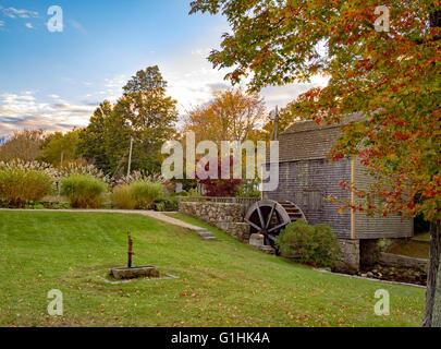 Dexter Grist Mill, Sandwich, Cape Cod Massachusetts undershot wooden water wheel and millrace in autumn, fall colors colours Stock Photo