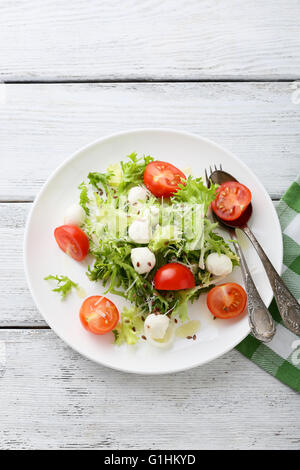 italian salad with tomatoes on plate, food Stock Photo
