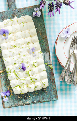 taste of summer, key lime pie and flowers Stock Photo