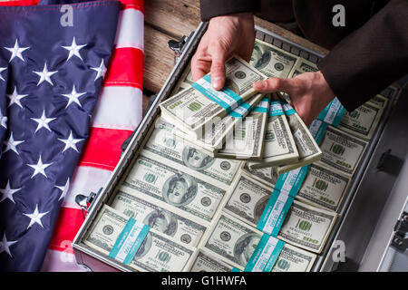 Male hands holding dollar bundles. Stock Photo