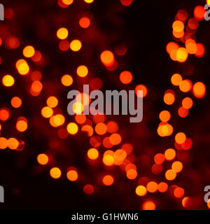 Yellow, orange and red festive Christmas elegant abstract background with bokeh lights and stars Stock Photo