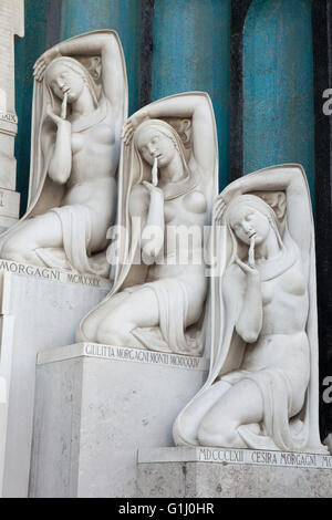 Memorial to Italian journalist Tullo Morgagni and his son journalist Manilo Morgagni designed by architect Enzo Bifoli (1921-1930) at the Monumental Cemetery (Cimitero Monumentale di Milano) in Milan, Lombardy, Italy. Tullo Morgani died in the Verona air disaster in 1919. His son Manilo Morgagni, chairman of the Stefani News Agency, died on July 25, 1943. The memorial was redesigned in 1929-1930 when an epitaph in gilded letters dictated and signed by Benito Mussolini was added. Stock Photo