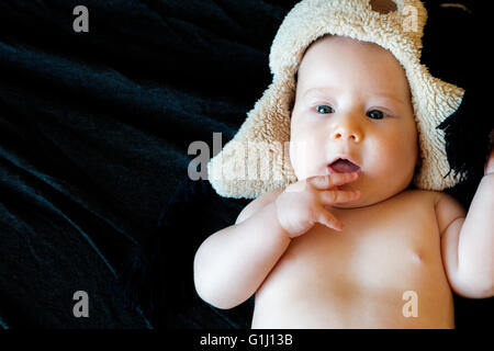 innocent baby on a black background Stock Photo