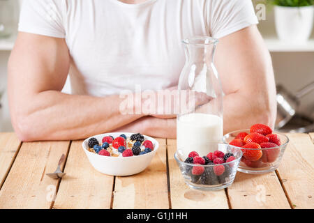 Healthy and nutritious organic yogurt with cereal and fresh raw berries Stock Photo