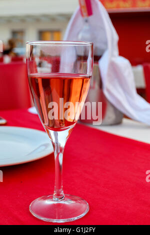 Red rose wine in a wine glass Stock Photo