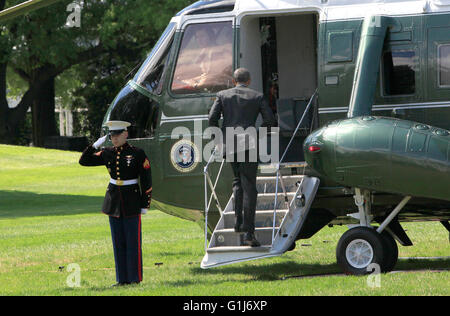 United States President Barack Obama boards Marine One as he departs the White House in Washington, DC en route to Joint Base Andrews where he will fly to New Brunswick, New Jersey to deliver a commencement speech at Rutgers University on May 15, 2016. Credit: Dennis Brack/Pool via CNP - NO WIRE SERVICE - Stock Photo