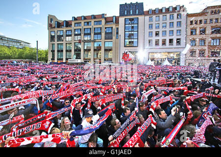 Leipzig, Germany. 16th May, 2016. Fans of RB Leipzig celebrating their teams ascent to the first Bundesliga on the market square in Leipzig, Germany, 16 May 2016. PHOTO: JAN WOITAS/dpa/Alamy Live News Stock Photo