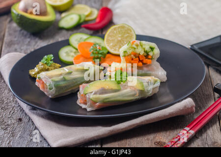 Spring rolls with vegetables and avocado Stock Photo