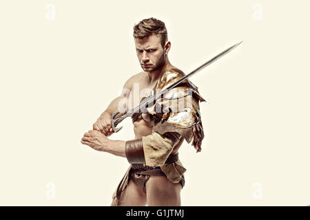 Muscular warrior with sword against of white background Stock Photo - Alamy