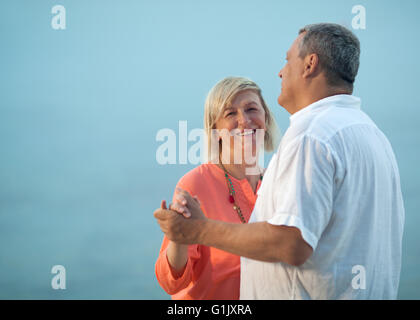 Middle-aged couple dancing on a romantic song Stock Photo