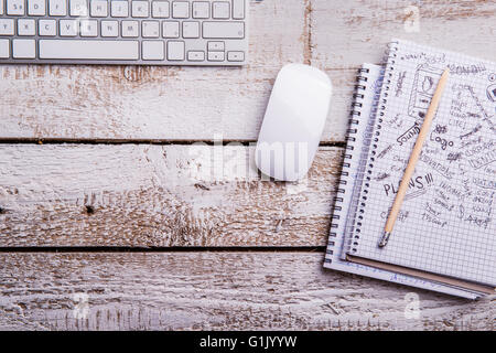 Computer keyboard and mouse, notebooks. Flat lay. Copy space. Stock Photo