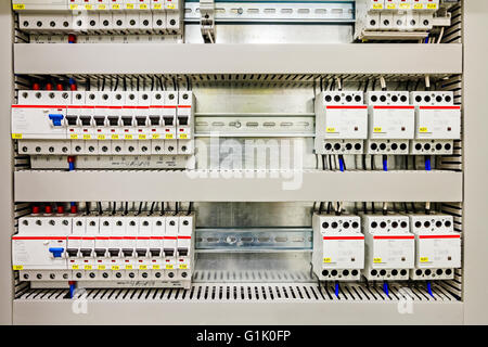 Automatic fuse electrical connector in power lines located inside of switch control panel board. Stock Photo