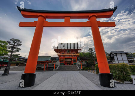 Inari shrine entrance torii at sunrise in Kyoto, Japan Stock Photo