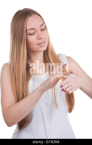 Woman applies cream on hands Stock Photo