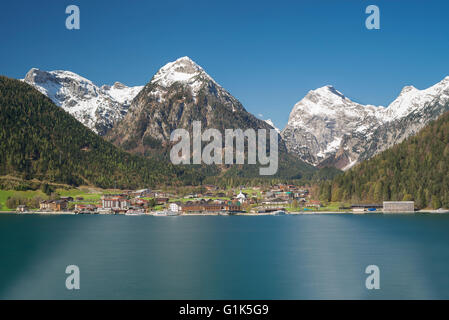 Village of Pertisau at Lake Achensee with snow-capped mountains of the Karwendel range on a sunny spring day, Tirol, Austria Stock Photo