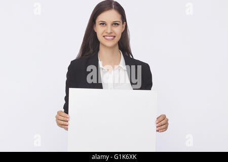 Young smiling woman show blank card Stock Photo