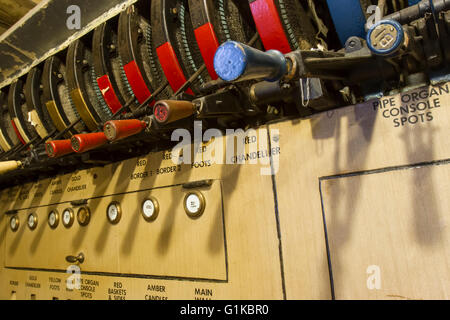 Wooden handles and gages on vintage stage lighting control panel. Stock Photo