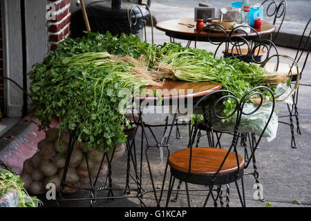Coriander over table in a mexican taqueria. Ciudad de Mexico, Mexico. Stock Photo