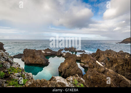 Natural volcanic pools with sea water in Porto Moniz. Stock Photo