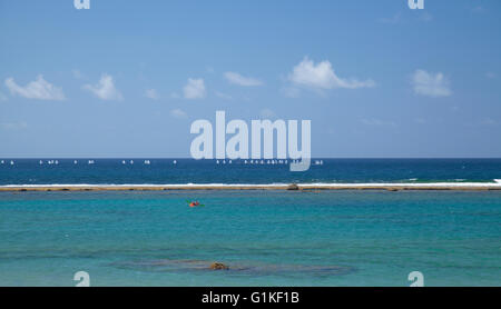 Las Canteras beach in Las Palmas de Gran Canaria, sedimental rock barrier La Barra visible in low tide Stock Photo