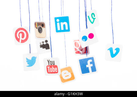 BELCHATOW, POLAND - AUGUST 31, 2014: Popular social media website logos printed on paper and hanging on strings. Stock Photo