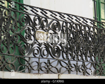 Wrought iron balcony railing with 1857 date Stock Photo