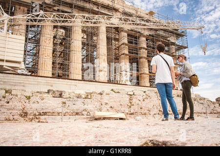 Tourists visit the ancient acropolis hill. Athens, Central Athens. Greece Stock Photo