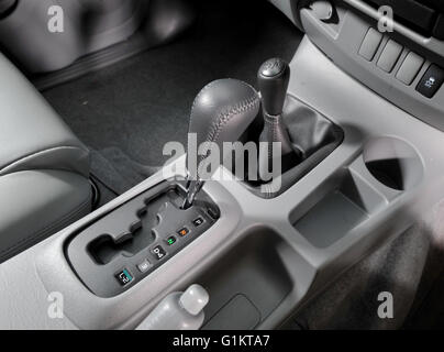 Automatic gearshift selector in a 2009 Toyota Hilux pickup truck loaded with trees and plants Stock Photo
