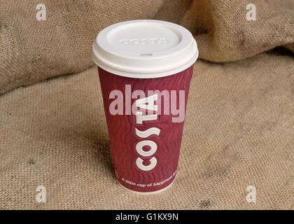 A takeaway Costa coffee cup on a Hessian background Stock Photo