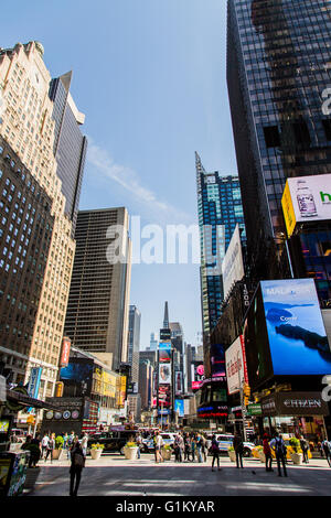 NEW YORK, USA - APRIL 21, 2016: Unidentified people on the Times Square, New York. Times Square is the most popular tourist loca Stock Photo