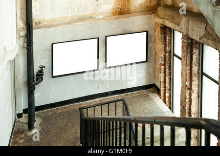 Grunge building with two picture canvas frames Stock Photo