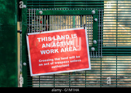 Security sign on a fence at a secure work site